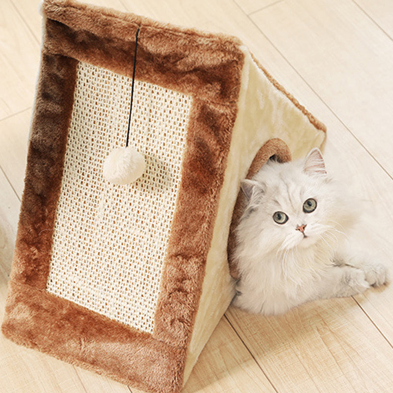 Brown and beige plush triangle cat house with woven scratch panel, hanging pom-pom ball and round side entrance