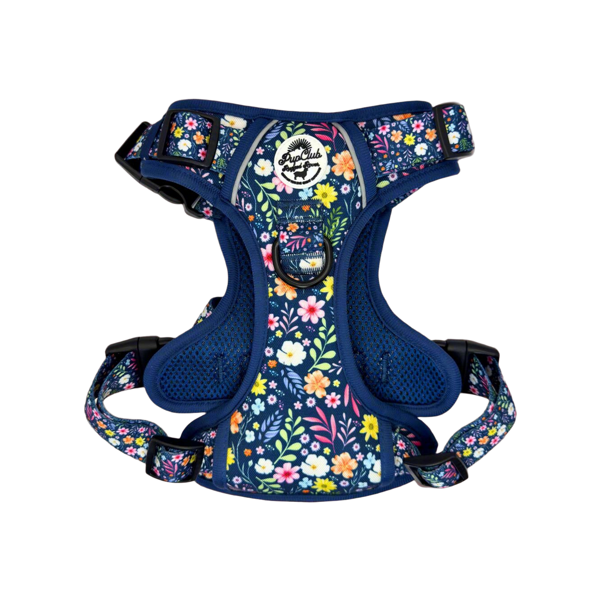 Navy blue padded dog harness with colourful floral print, mesh lining, D-ring, grey reflective trim and black buckles